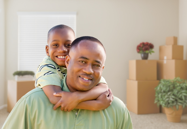 A dad and his son in their new home - buying a home in Houston Texas